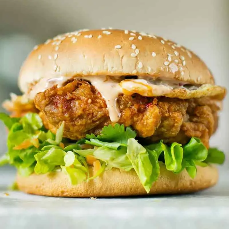 Crispy Chicken Cheese Burger from Manikdi Cafe & Burger — order online on FoodLemon
